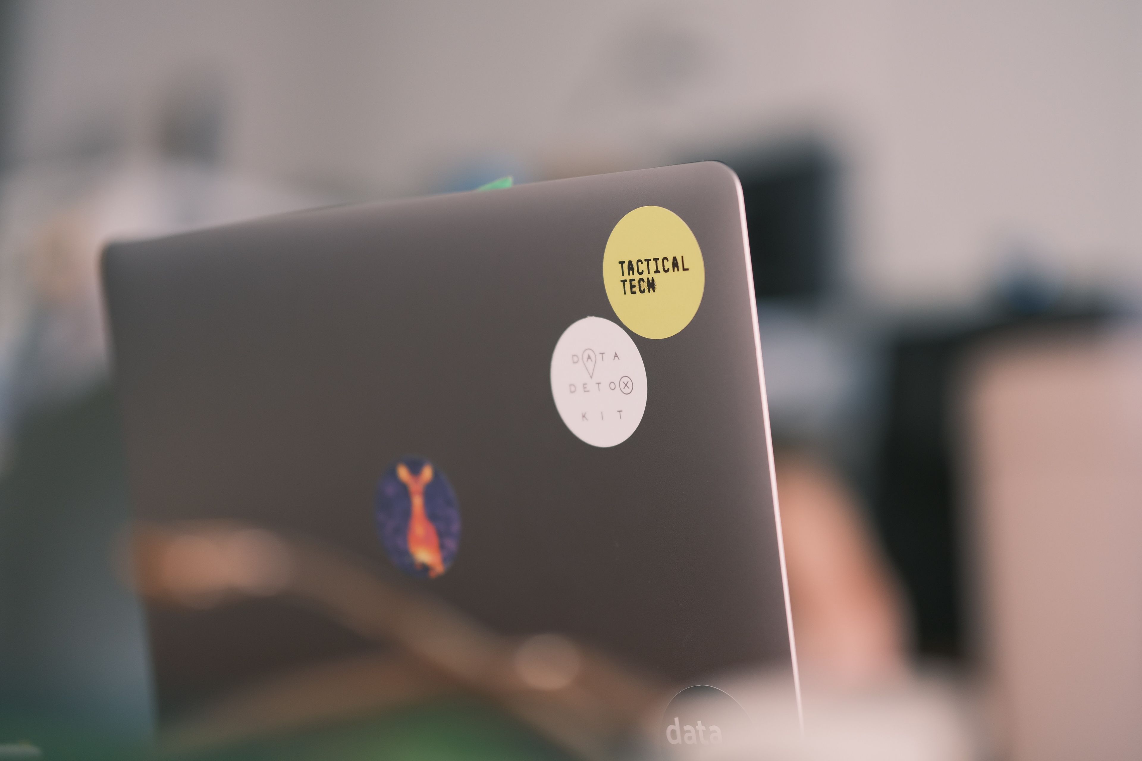 Laptop with stickers of Tactical Tech